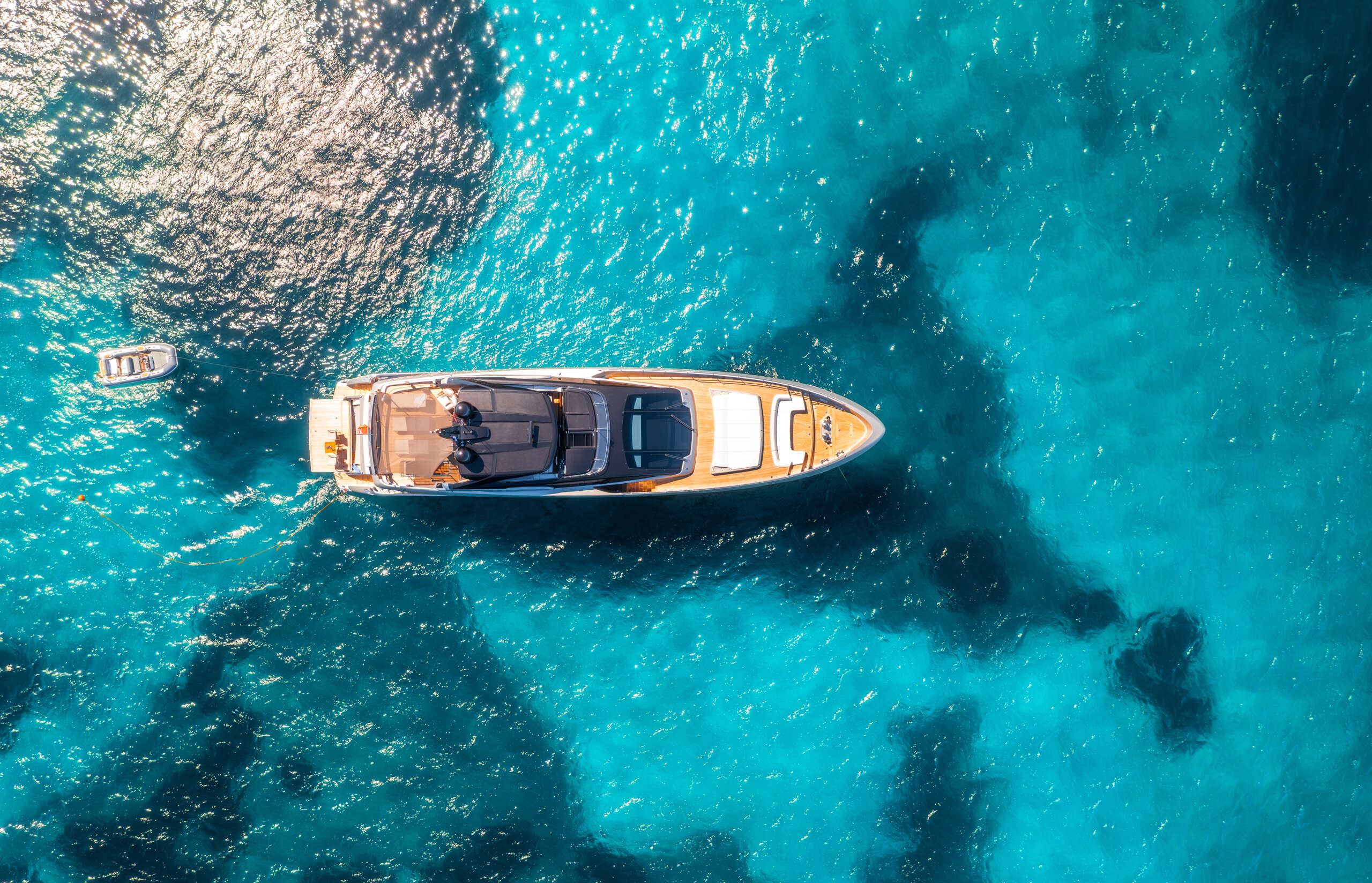 aerial view of luxury yacht and boat in blue sea in summer